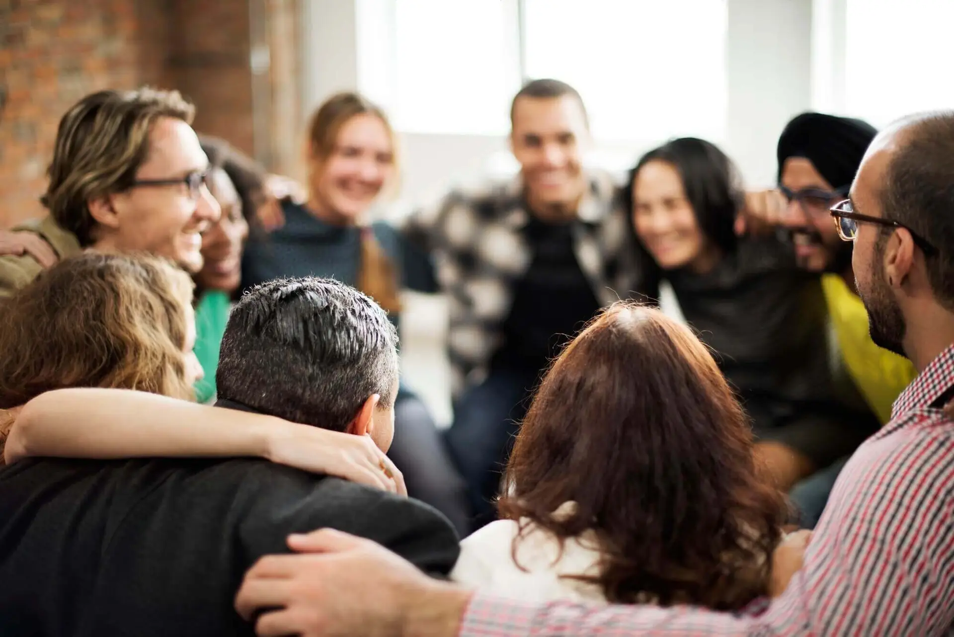 Community team doing a group hug